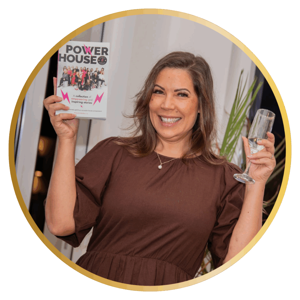 Nicole in a brown dress holding a glass of champagne holding the Power House book