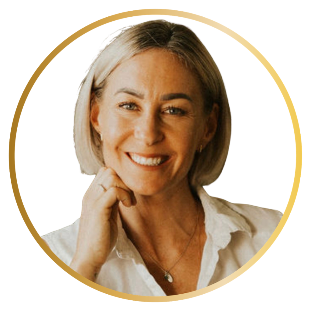 Professional headshot of Kat Cuthbert, psychotherapist, smiling warmly while seated in a tan armchair holding a notebook and pen. Kat specialises in online therapy using CBT and EMDR techniques