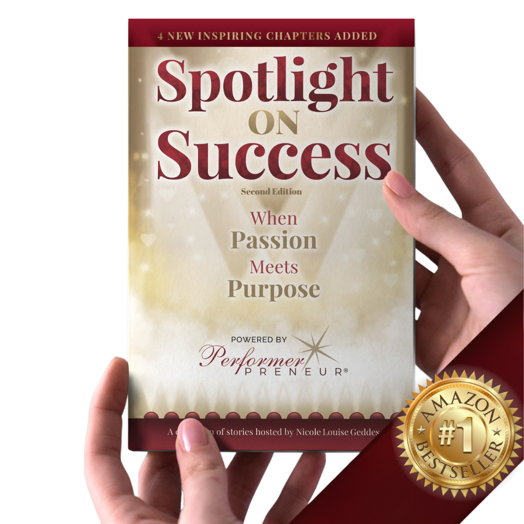 Hands holding the second edition of Spotlight on Success: When Passion Meets Purpose, powered by PerformerPreneur and hosted by Nicole Louise Geddes, with a gold Amazon #1 Bestseller seal and a banner reading "4 new inspiring chapters added".